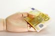 Bank Note in a Wooden Hand