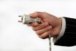hand with an electric plug