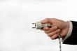 hand with an electric plug