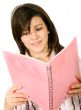 beautiful student reading a notebook
