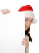 santa hiding behind a card