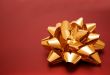 beautiful golden ribbon on red gift