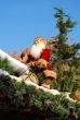 Santa Claus sits on a roof