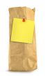 brown paper bag with yellow note