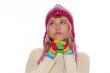 Thoughtful girl in pink cap and Multi-coloured gloves