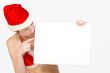 Christmas girl holding up a white sign