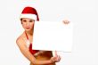 Christmas girl holding up a white sign