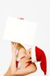Christmas girl holding up a white sign