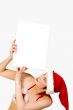 Christmas girl holding up a white sign