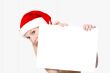Christmas girl holding up a white sign