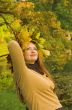 Portrait of the girl in a wreath from maple leaves