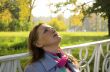 The red-haired woman has a rest in park