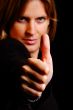 woman shows thumb