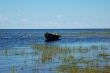 An old fishing boat near the lake bank