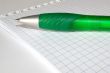 notebook and a green pen