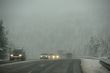 Traffic moving through fog