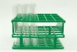 Glass tubes in green plastic holder