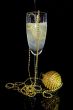 glass of champagne and christmas decoration