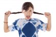 girl holding braids and shouting