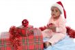 baby girl with christmas presents