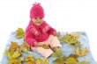 Baby playing with leaves