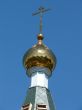 Church Cupola with Holy Cross upon blue sky
