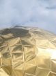 Golden church cupola mirroring surface