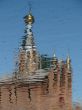 Church Cupola with Cross mirrored in waves