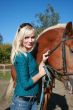 female model with brown horse close-up portrait