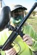 paintballer with marker gun and protective mask