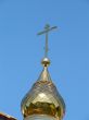 Church Cupola with Holy Cross upon blue sky