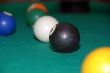 billiards table with pool balls