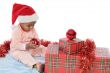 baby girl with christmas presents