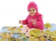 Baby playing with leaves