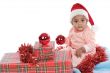 baby girl with christmas presents