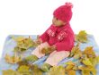 Baby playing with leaves