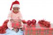 baby girl with christmas presents