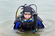 scuba diver entering the water