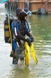scuba diver entering the water