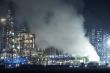 Oil refinery with cloudscape