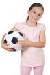 girl holding a soccer ball
