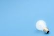 Background with lit lightbulb