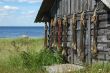 Fishing net on the shed wall near lake