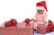 baby girl with christmas presents