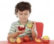 child playing with fruits