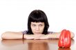 girl watching a red pepper