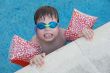 boy learning to swim