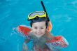 boy learning to swim