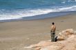Young men watching the sea