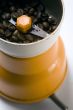 Grain coffee in a grinder